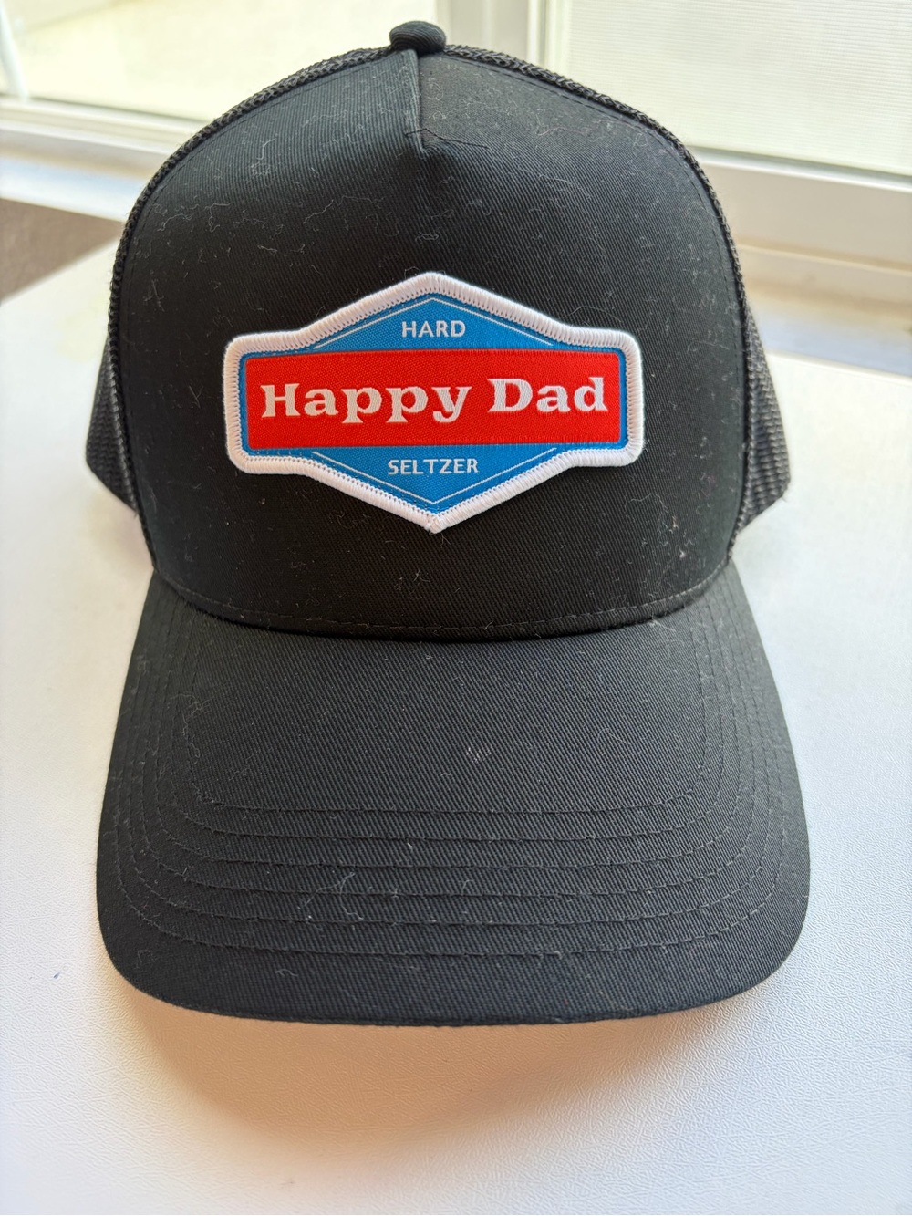Happy Dad Black Trucker Cap - Happy Dad Hard Seltzer Logo